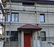 Облицовка двухэтажного дома из пеноблоков