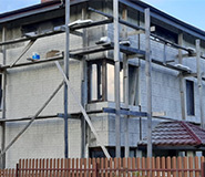 Облицовка двухэтажного дома из пеноблоков